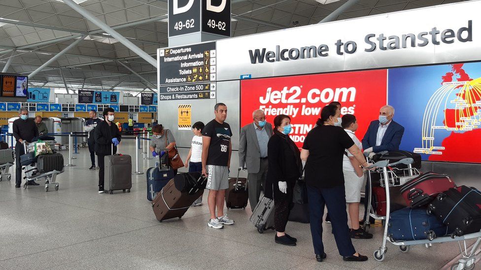 Travellers at Stansted Airport