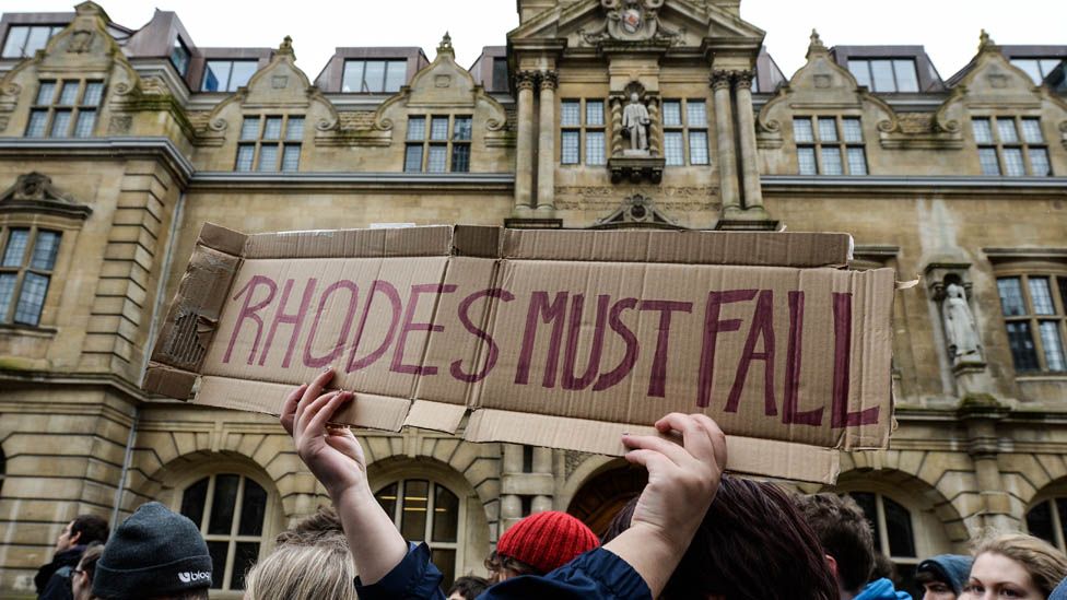 Students march past Oxford University's Oriel College in 2016 calling for the removal of Cecil Rhodes's statue