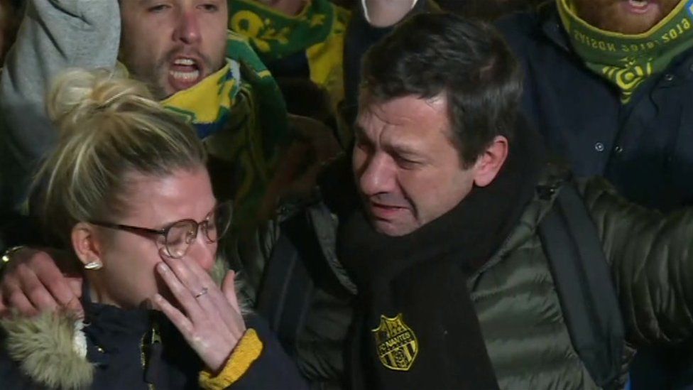 Nantes fans crying at a vigil for Emiliano Sala