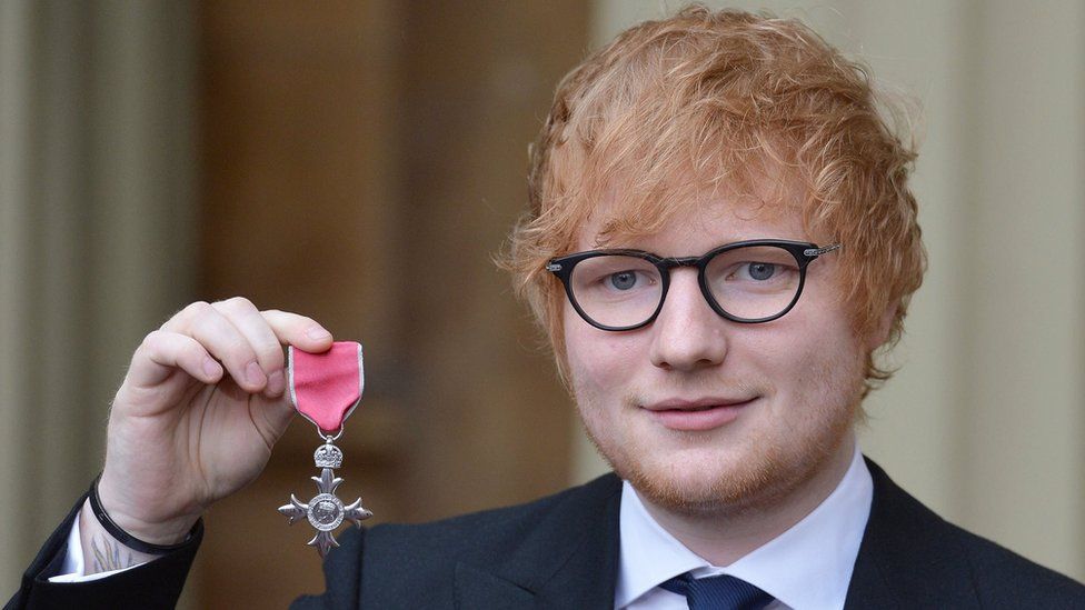 Ed Sheeran with his MBE after Investiture ceremony at Buckingham Palace