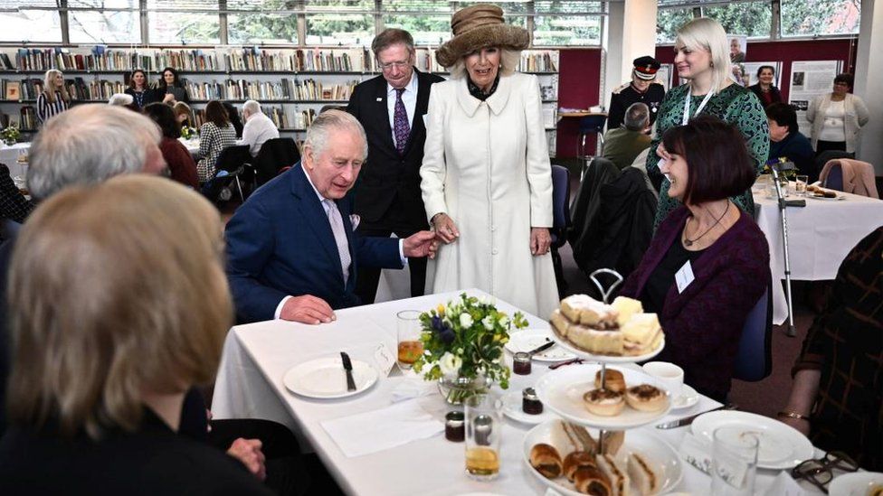 King Charles and Camilla at an afternoon tea