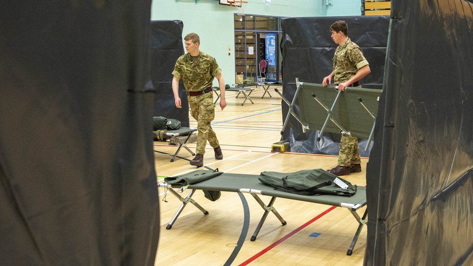 Soldiers build beds
