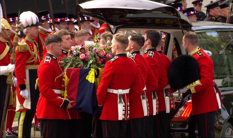 The Queen's coffin is placed into a hearse