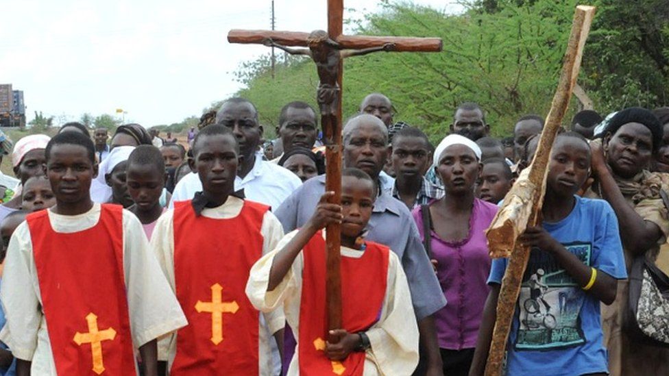 Catholic Church faithfuls take part in a procession, to re-enact the crucifixion of Jesus Christ, on April 3, 2015 in Machakos, during the Holy Week celebrations