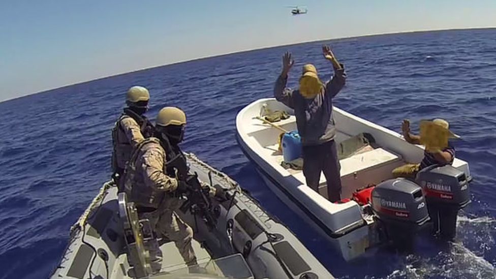 A Spanish force boards a boat off Libya