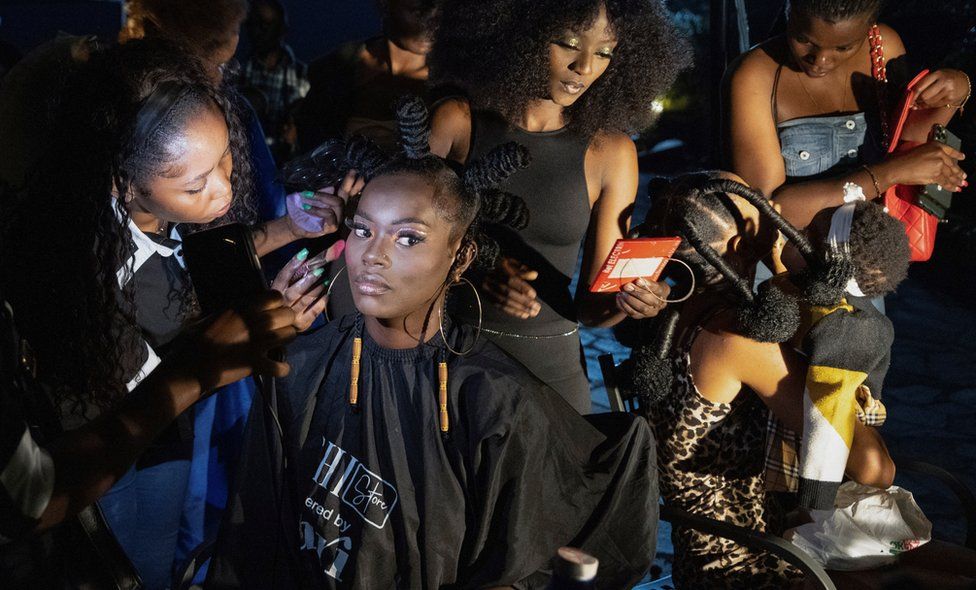 Models get their make-up done back stage before the start of the One Fashion Week aimed at combatting discrimination.