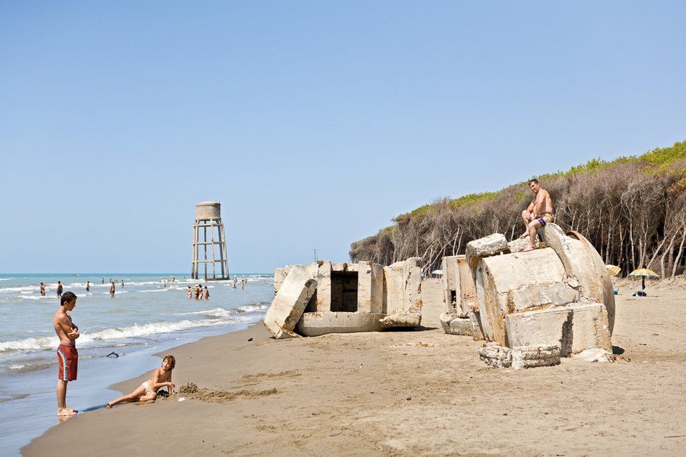 The ruins of bunkers in Albania on a beach