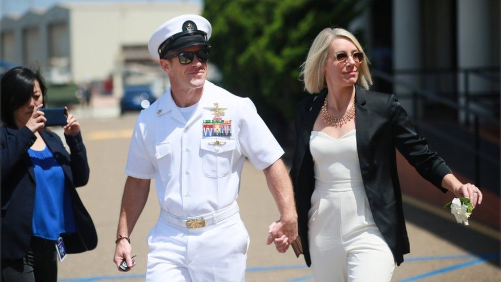 Navy Special Operations Chief Edward Gallagher walks out of military court with his wife Andrea Gallagher.
