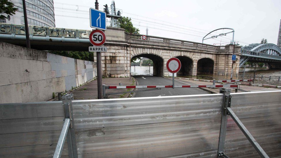 Emergency barriers being erected in Paris as flood waters threaten the city
