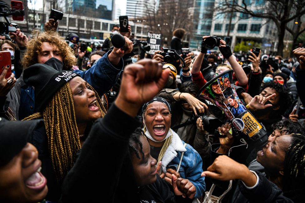 People celebrate as the verdict is announced in the trial of former police officer Derek Chauvin outside the Hennepin County Government Center in Minneapolis, Minnesota on 20 April 2021