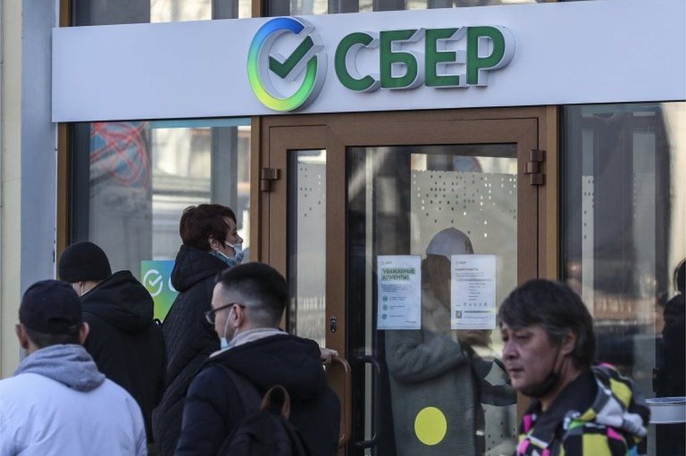 People stand in line outside the Russian credit institution Sberbank in Moscow, Russia, 28 February 2022.