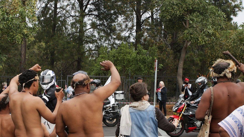 KhoiSan people wave in solidarity with Bikers United Against Farm Murders and Racism as they ride past the Union Buildings in Pretoria, on August 29, 2020