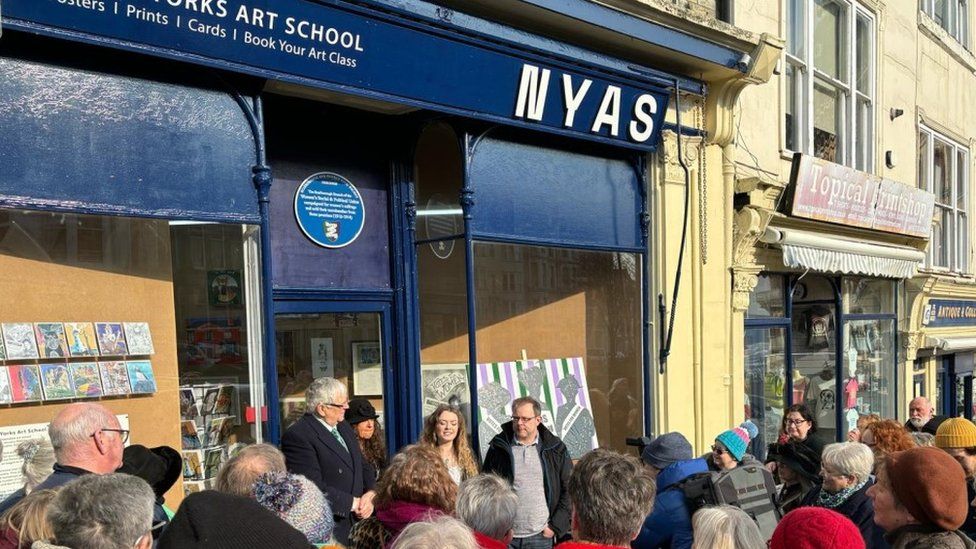 Crowds gathered on Friday outside the North Yorks Art School shop, in St Nicholas Cliff, Scarborough, to see the plaque