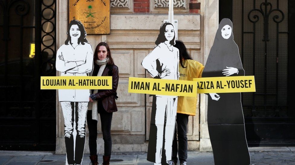 A protester in Paris calling for the release of detained Saudi women's rights activists