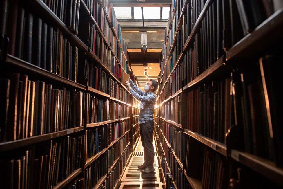 Chung Hoon arranges books in the rear book stacks at the London Library, in St James Square, London, ahead of its planned reopening to members on April 12th as the government eases current coronavirus restrictions.