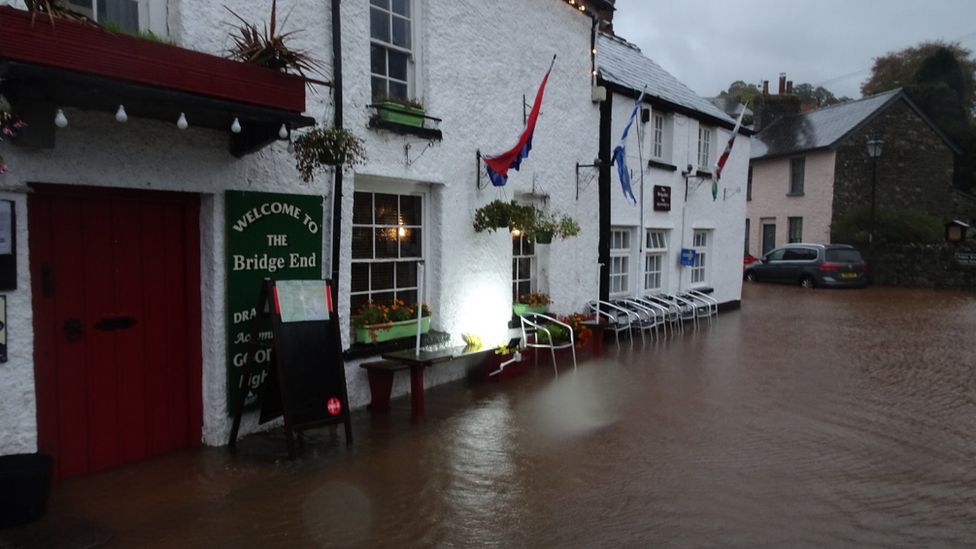Flood water up to a pub door in Crickhowell