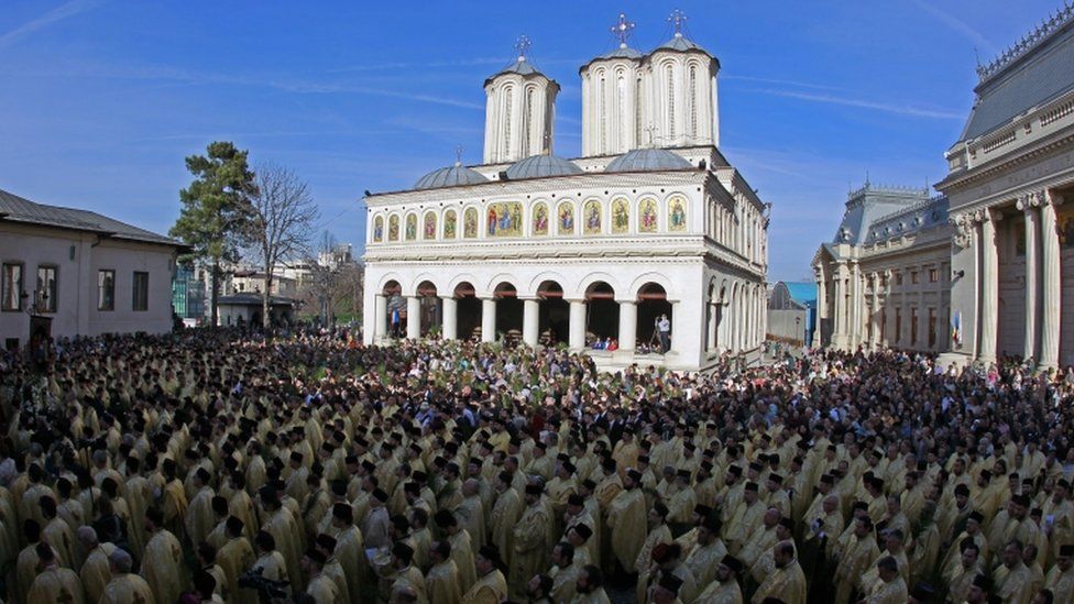 Priests wearing ceremonial outfits attend a pilgrimage ahead of Orthodox Palm Sunday in Bucharest, Romania, 31 March 2018.