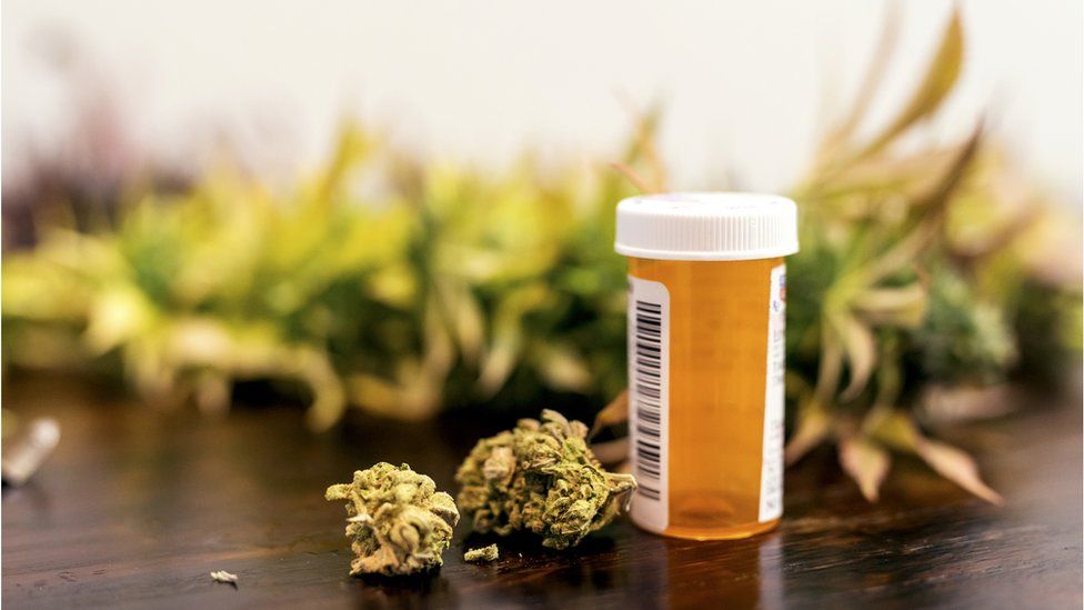 file picture of cannabis and prescription bottle