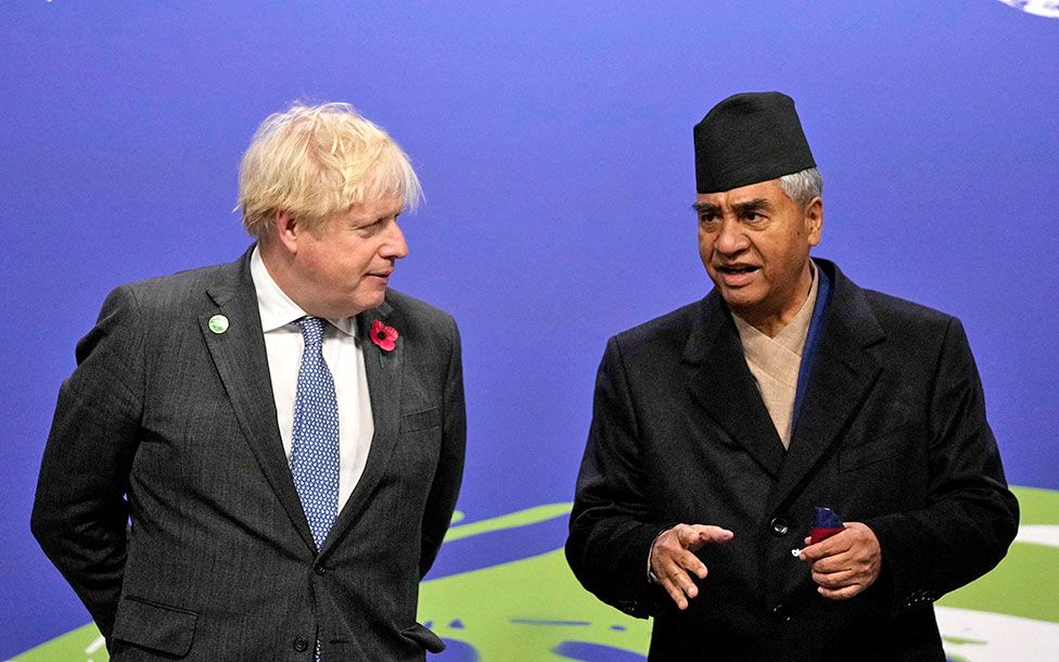 Prime Minister Boris Johnson (left) and Nepal's Prime Minister Sher Bahadur Deuba at the COP26 UN Climate Change Conference in Glasgow, Scotland on 1 November 2021