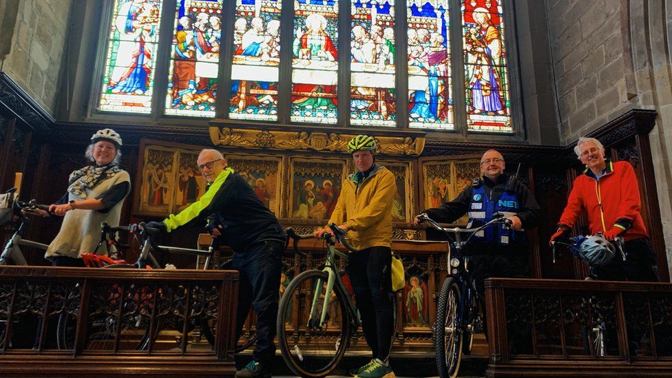 Cyclists inside Newcastle Cathedral
