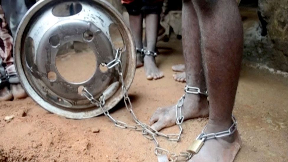 People with chained legs are pictured after being rescued from a building in the northern city of Kaduna, Nigeria September 26, 2019, in this grab obtained from a video.