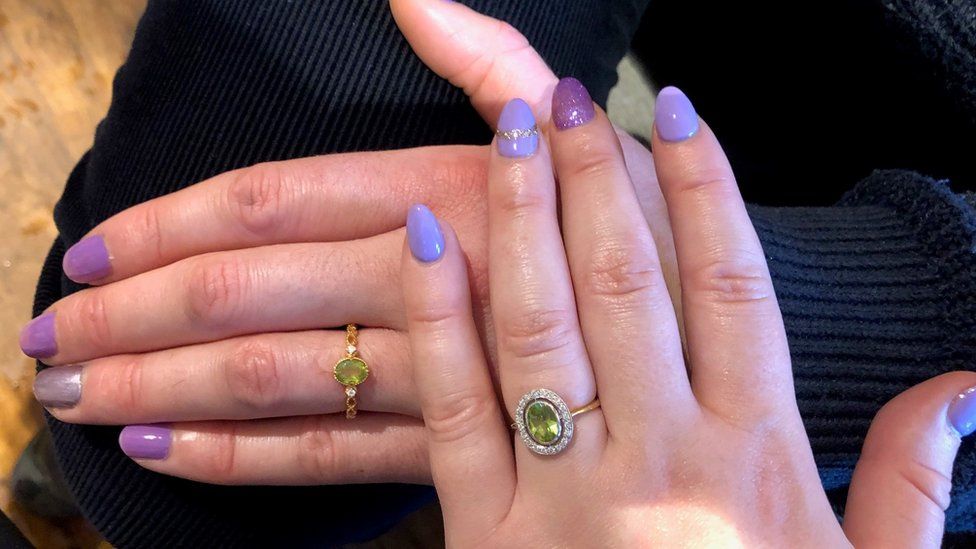 Bee Nichols and James Kavanagh's hand with their engagement rings