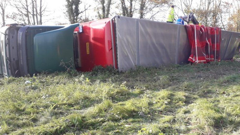 Overturned lorry.
