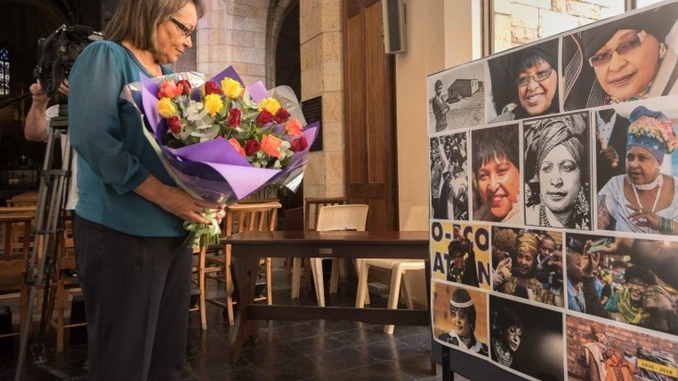Cape Town mayor Patricia de Lille brings flowers for a memorial at St George"s Cathedral for the late South African anti-apartheid campaigner Winnie Madikizela-Mandela