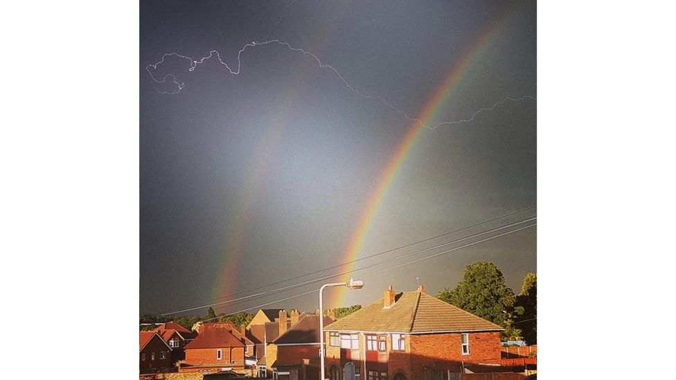 Lightning over a double rainbow