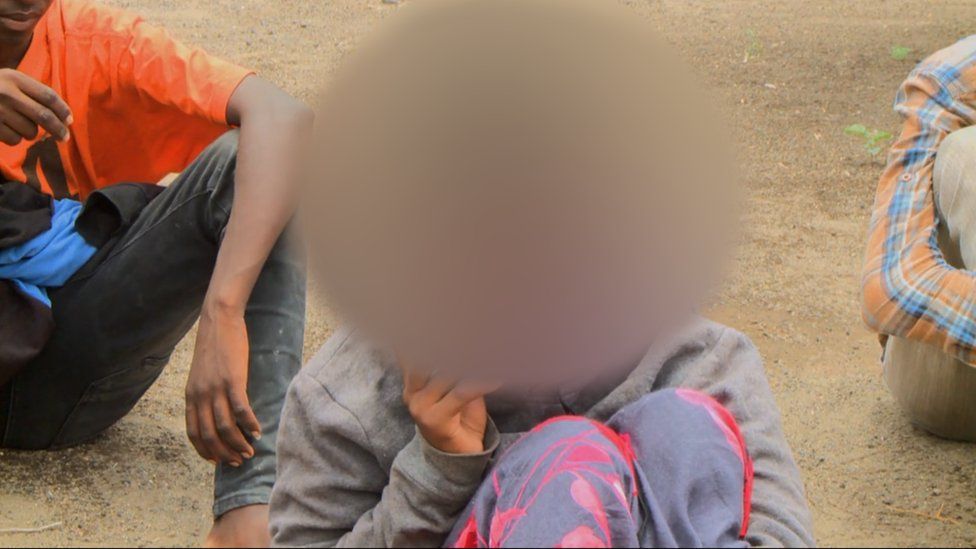 a blurred photo of a teenager in afar