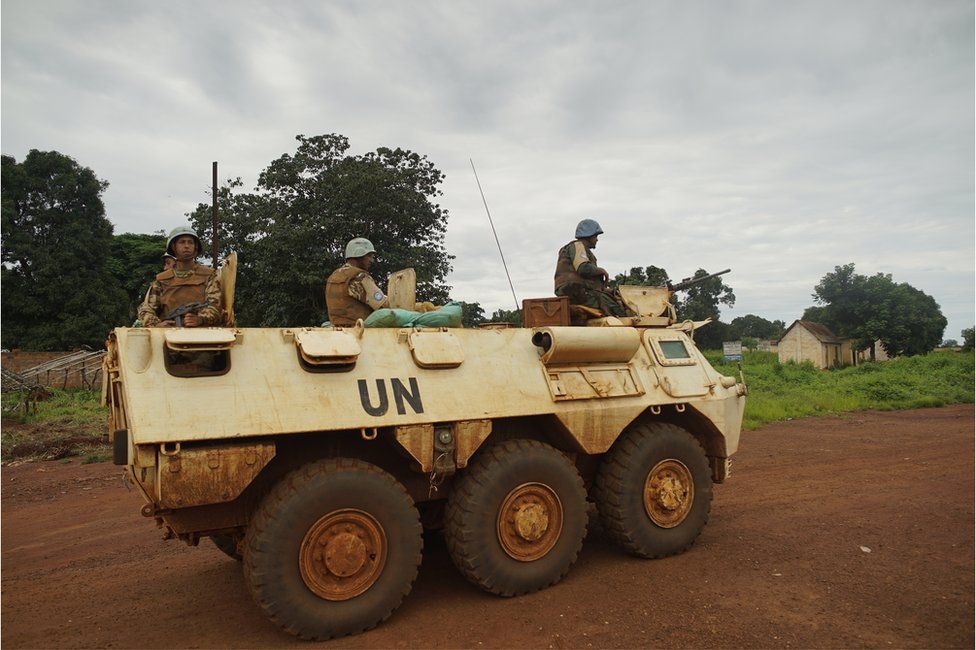 UN peacekeepers on patrol in an armoured tank