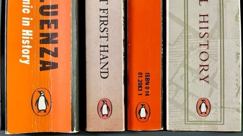 Book spines with Penguin logo.