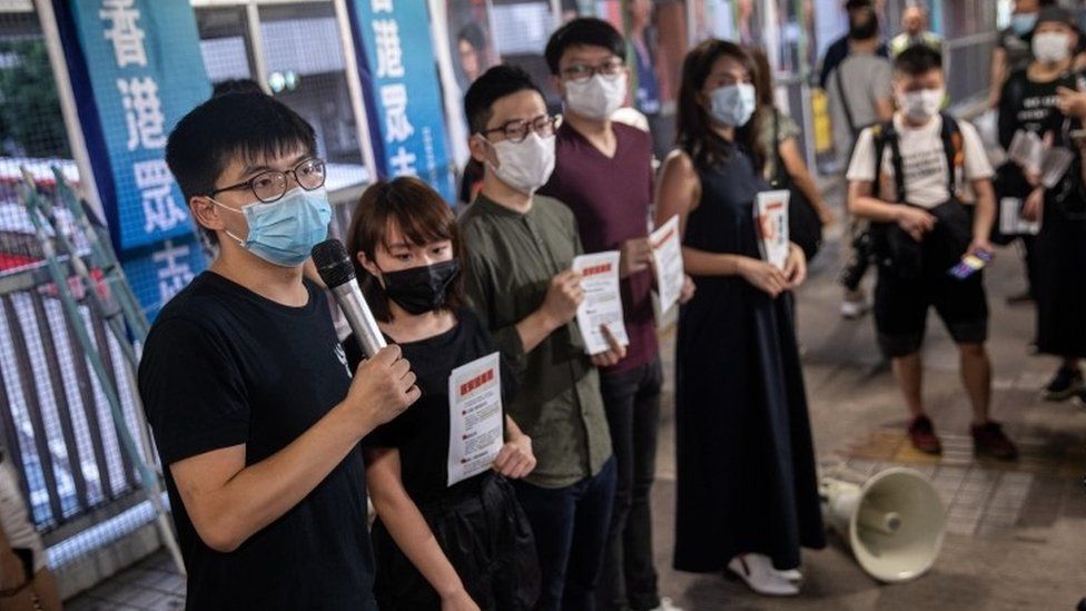 Pro-democracy activists distribute flyers against China's controversial national security law for Hong Kong