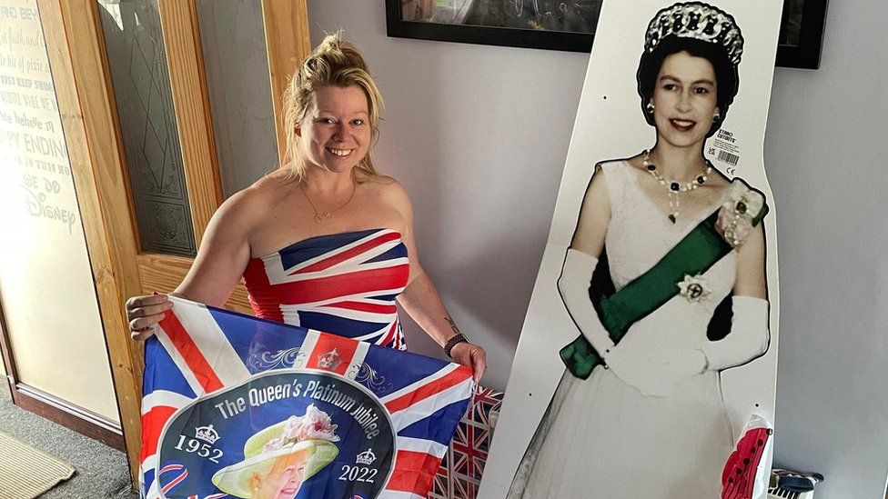 Becky Norman with a cardboard cut out of the Queen