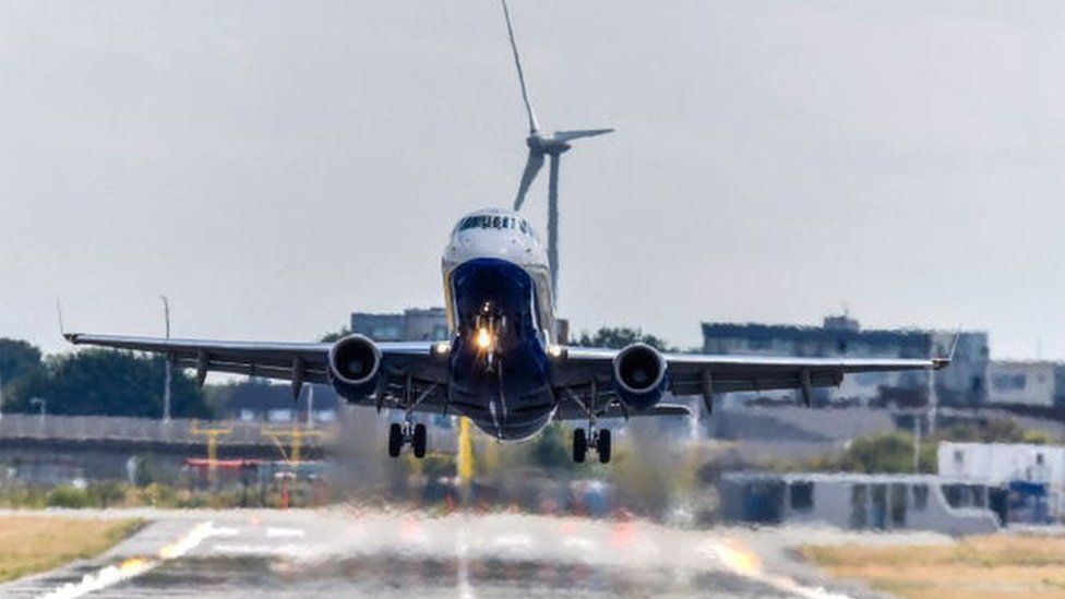 A plane takes off from London City Airport