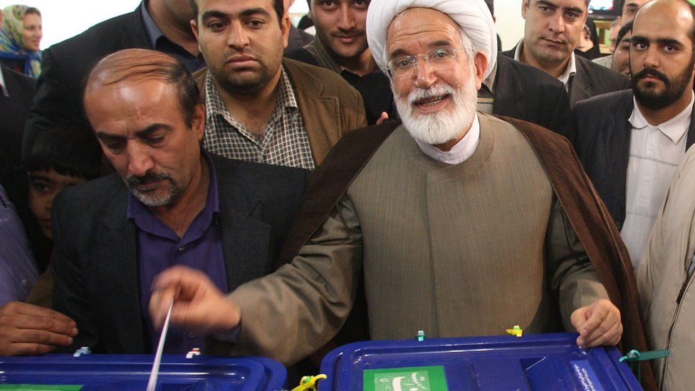 Mehdi Karroubi casts his ballot at a polling station in Tehran on 12 June 2009