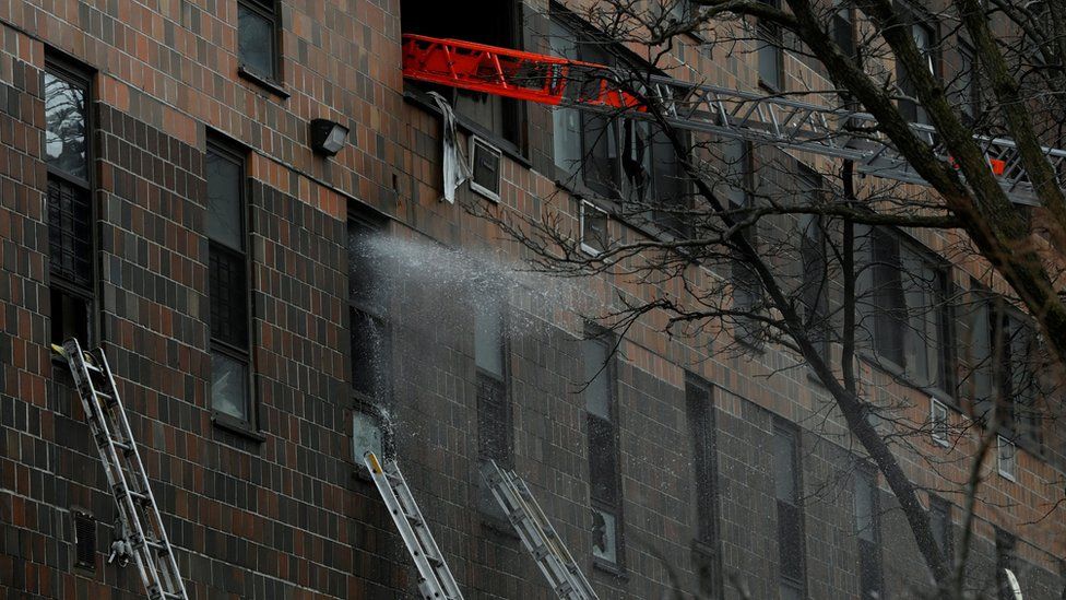 Emergency personnel from the FDNY respond to an apartment building fire in the Bronx borough of New York City, U.S., January 9, 2022