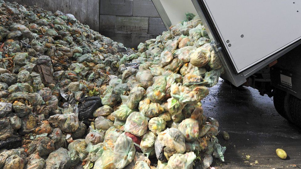 Food waste is unloaded at a recycling centre