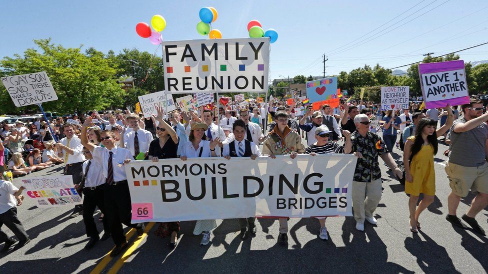 In this June 2, 2013, file photo, members of the Mormons Building Bridges march during the Utah Gay Pride Parade in Salt Lake City.
