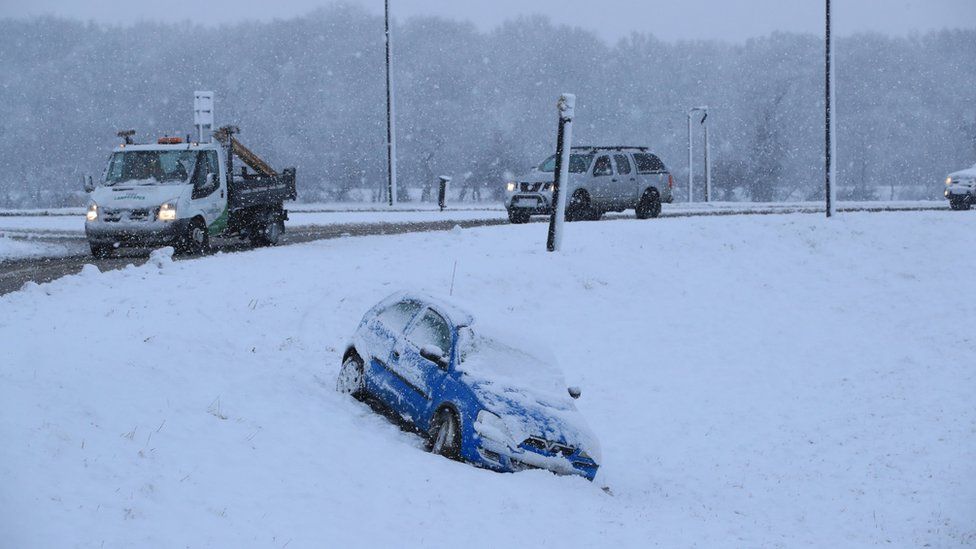 Car off road in snow