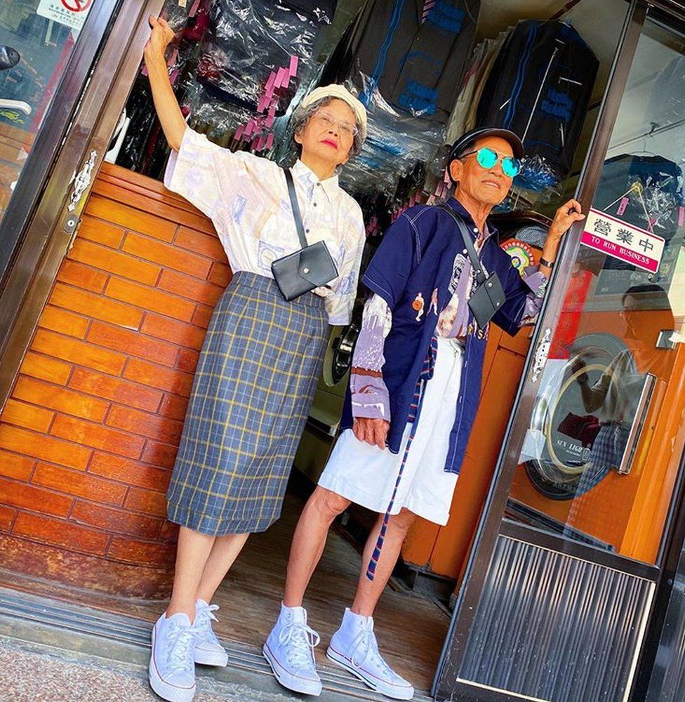 Chang Wan-ji and Hsu Hsiu-e pose outside their shop