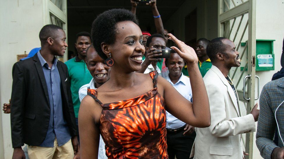 Diane Rwigara (front L), a critic of Rwanda's President, reacts as she leaves the Kigali's High Court
