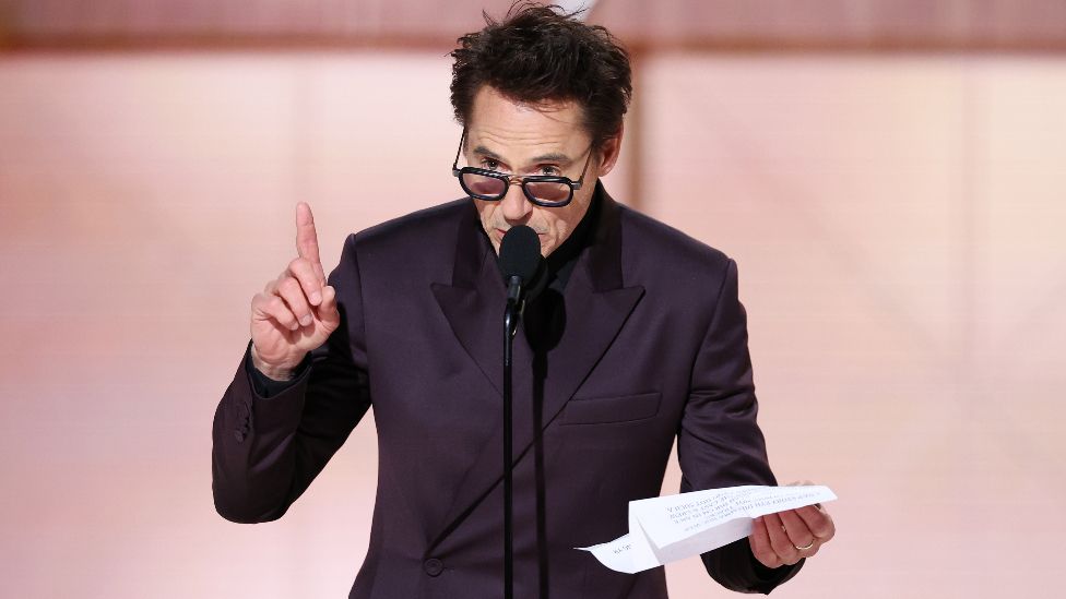 Robert Downey Jr. accepts the award for Best Performance by a Male Actor in a Supporting Role in Any Motion Picture for "Oppenheimer" at the 81st Golden Globe Awards held at the Beverly Hilton Hotel on January 7, 2024 in Beverly Hills, California