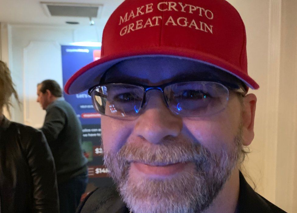 man wearing Make Crypto Great Again cap
