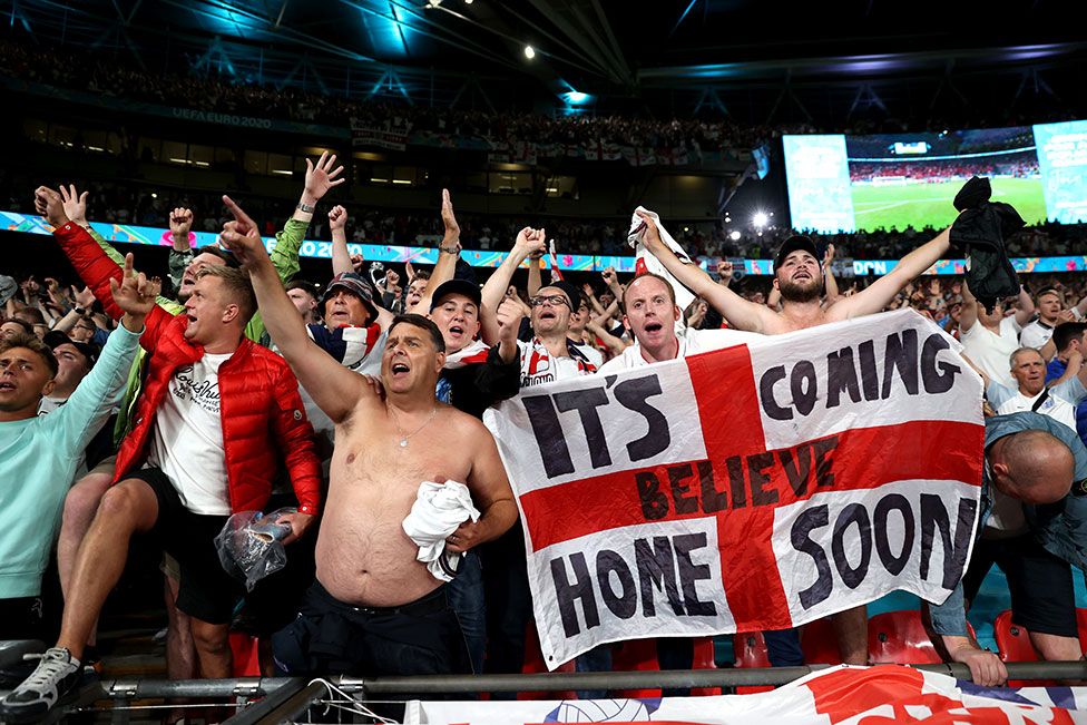 Fans of England celebrate their side's victory after the UEFA Euro 2020 Championship Semi-final match between England and Denmark at Wembley Stadium