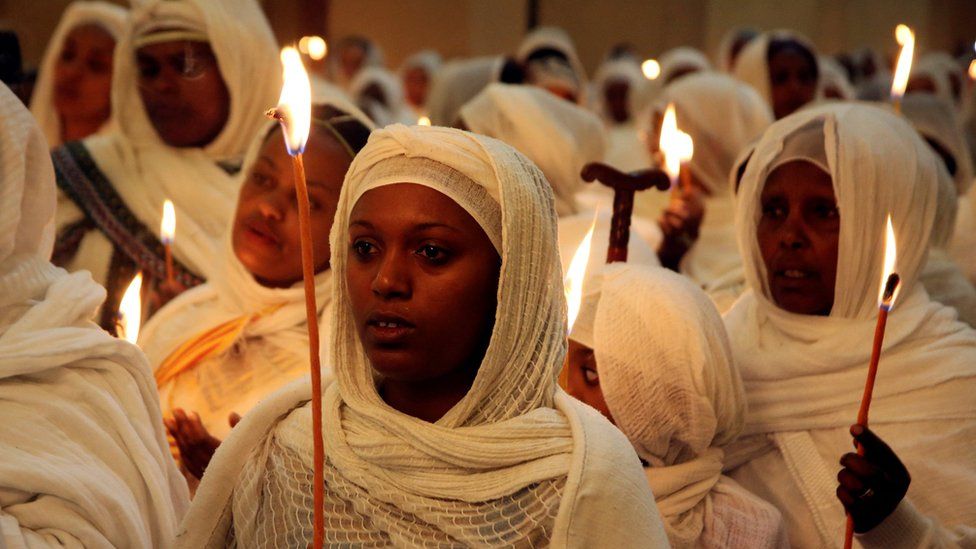 Ethiopians hold candles as they attend prayers at the Holy Trinity Cathedral Orthodox church in Addis Ababa - Saturday 7 April 2018
