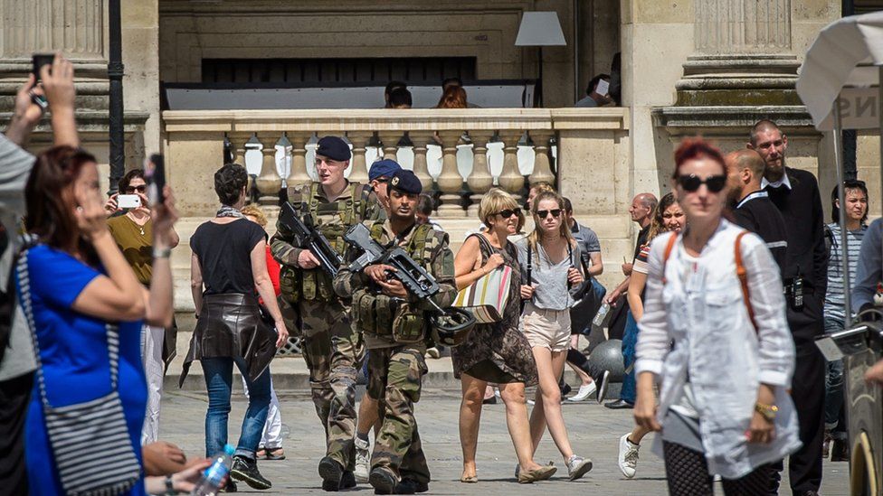 French soldiers patrol in front of the Louvre museum, in security measures after the Nice terror attack, in Paris, 15 July 2016