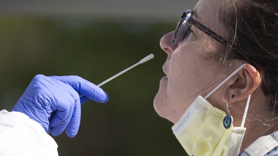 Caitlin Surprise of Jamaica Plain takes a Coronavirus test at a pop up testing center in Boston, Massachusetts, USA, 15 October 2020.