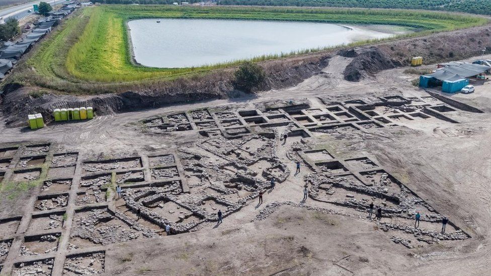 Aerial view of the excavation site reveals an organized grid system of the ancient city.