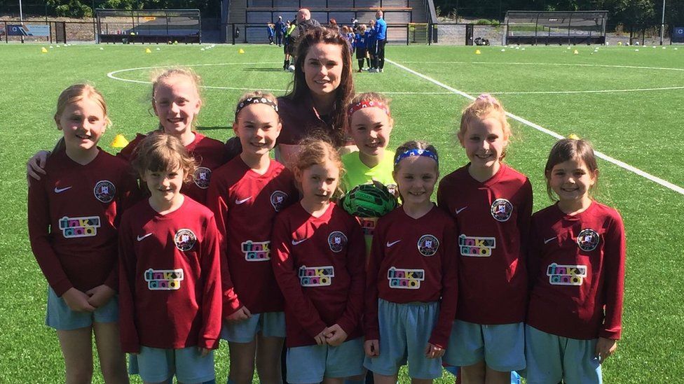 Coach Emma Gordon with Ballynahinch Olympic FC's Under-11s girls' team